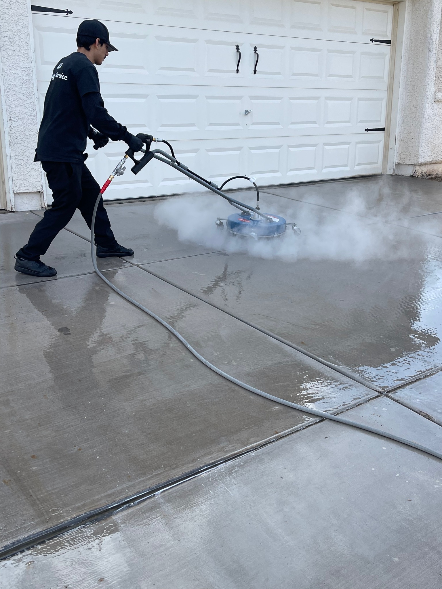 JCA hot-water surface cleaning in progress on concrete